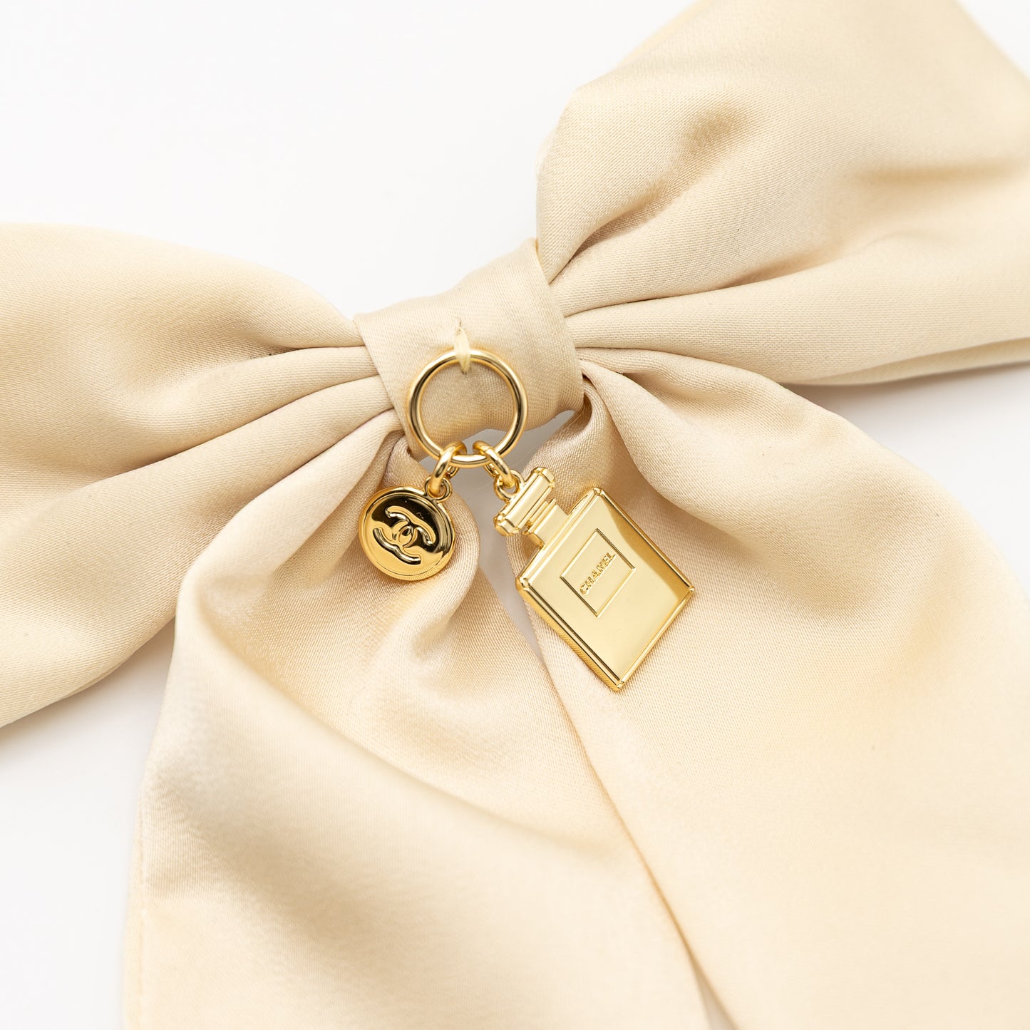 Beige Chanel Haarspeld - Parfumflacon